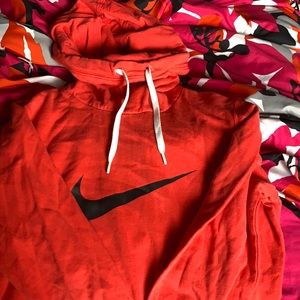 Red Nike sweatshirt.